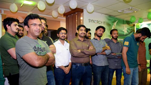 A group of men posing for a photo during an Independence Day party.